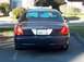 2001 Ford Crown Victoria - The rear of a Ford Crown Victoria is shown, with a license plate reading ADAM-12.