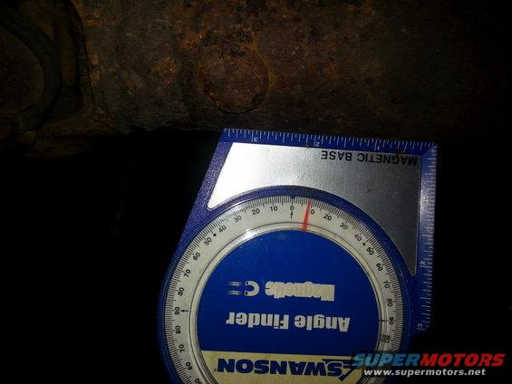 Angle finder tool measuring angle on rusty metal component