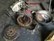 1997 Dodge 3500 - Disassembled transmission components, including a clutch and flywheel, are laid out on a workshop floor.