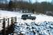 1979 Ford Bronco - A 1978 Ford Bronco is seen on a snowy road with a wooden bridge in the foreground.