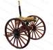 1972 Ford Ranchero - This brass gatling gun features wooden spoked wheels and a prominent brass barrel.