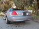 2006 Ford Crown Victoria - Rear view of a silver 2006 Ford Crown Victoria, chrome accents on the taillights and trunk lid.