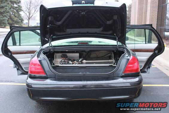 2005 Ford Crown Victoria rear view with trunk and doors open, showing installed equipment