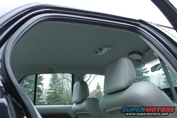 Gray leather interior of a 2005 Ford Crown Victoria, showing front seats and headliner