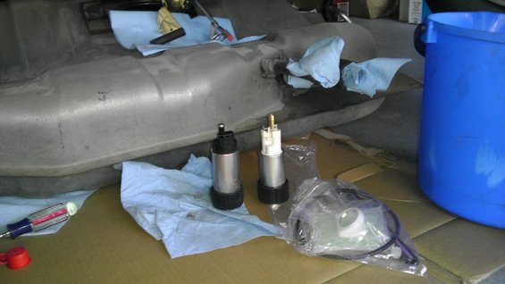 Fuel tank with two fuel pumps and a blue bucket