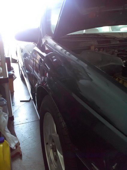 1993 Ford Taurus, dark green, hood open, parked indoors