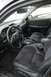 2002 Lexus IS 300 - The interior of a 2002 Lexus IS 300 features dark upholstery and a leather-wrapped steering wheel.