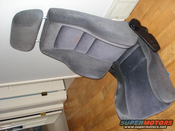 Gray fabric car seat with adjustable headrest and armrest