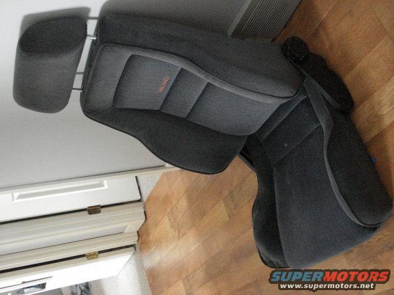 Two dark gray car seats with orange 'RECARO' logo on the backrest