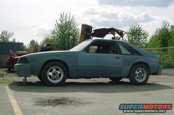 Gray coupe, side view, unfinished bodywork
