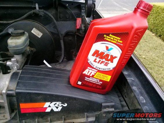 Bottle of Valvoline Max Life ATF on top of air intake box in engine bay. K&N logo visible