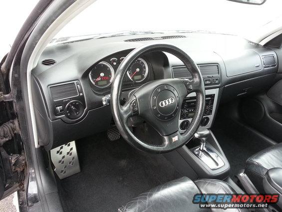 Interior shot of a car with an Audi steering wheel and TDI badge on the dash