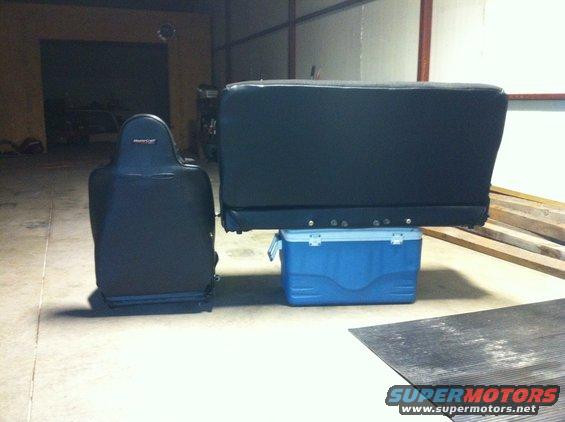 Black car seat and bench seat on a blue cooler