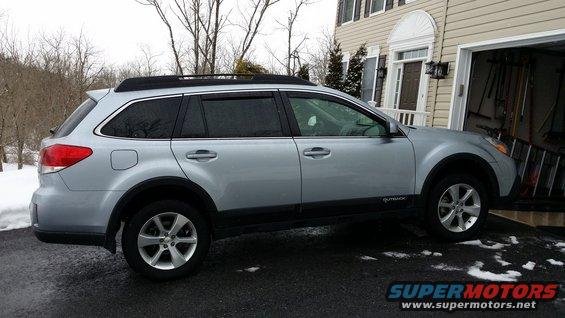 Silver Subaru Outback side view