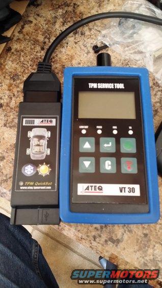 ATEQ VT30 TPMS service tool with connected programming device showing a car diagram