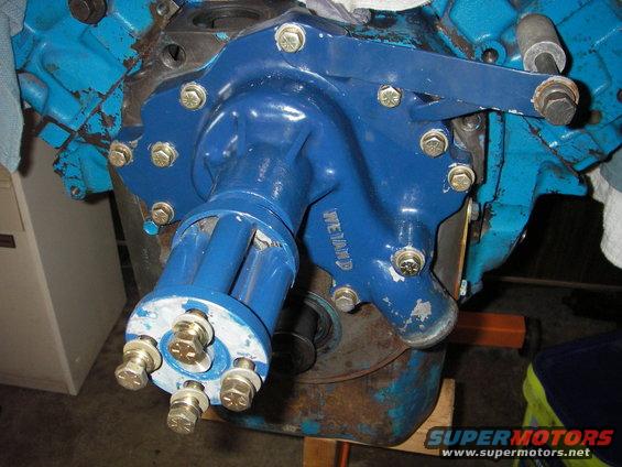 Blue water pump with 'WEILAND' text on engine block