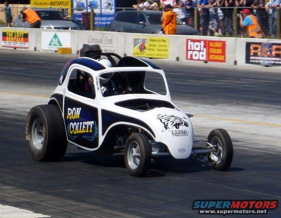 Drag racing car with 'RON COLLETT' and 'BRUTE POWER' text on the side, on a track