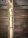 1964 Ford Ranchero - Close-up view of a rusted metal frame against a ribbed surface, possibly part of a vehicle's undercarriage.