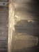 1964 Ford Ranchero - Corroded metal panel with horizontal ridges, possibly from a vehicle's undercarriage.