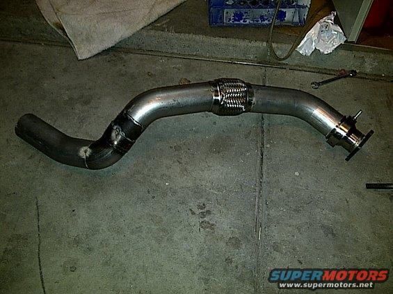 Exhaust pipe with flex joint and flange on concrete floor