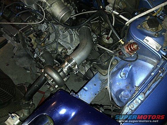 Engine bay with turbocharger and blue paint