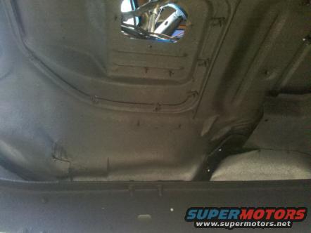 underside of a vehicle showing frame and floor pan, with "SUPERMOTORS.NET" watermark