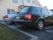 1999 Ford Fairlane - Rear view of a black Audi wagon parked next to a silver sedan. The license plate reads PB-WG 2006.