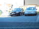 1999 Ford Fairlane - Two station wagons, an Audi and a silver sedan, are parked on a paved driveway.