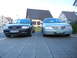 1999 Ford Fairlane - Two cars, an Audi and a silver sedan, are parked side-by-side on a paved driveway.