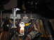 1979 Ford F-150 - A complex dashboard wiring harness with many colorful wires and a single illuminated bulb.