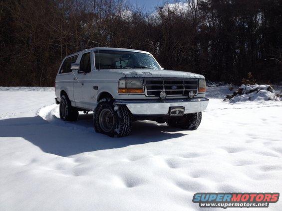 White 1992 Ford Bronco in snow, front quarter view