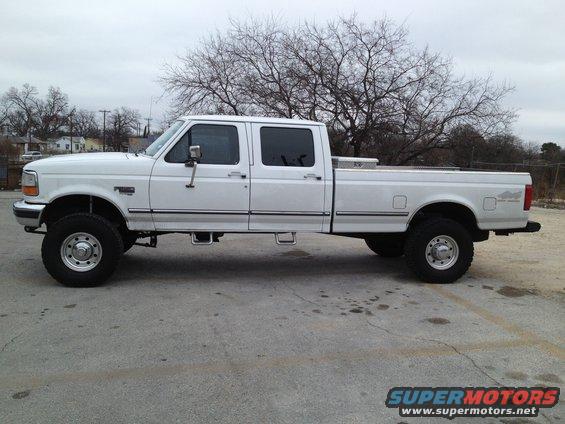 White 1997 Ford F-350 crew cab pickup truck, side view