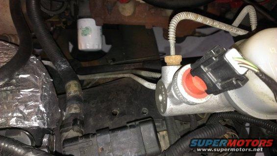 Brake master cylinder with red seals and electrical connector