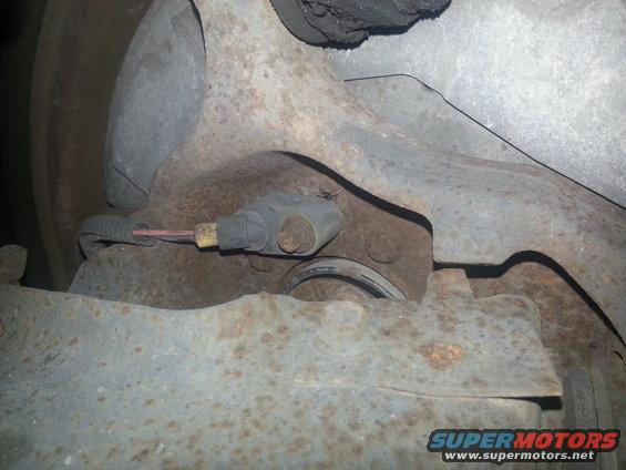 ABS sensor attached to rusty brake assembly