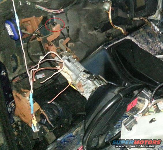 Car interior with exposed wires and parts of the dashboard removed