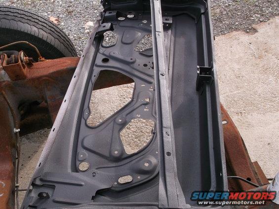 Both doors shot in 3-M undercoating before door skins are installed.