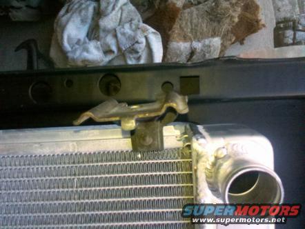1982 Ford Bronco radiator and mounting bracket, close-up view
