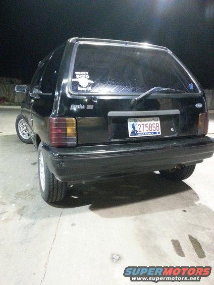 Black 1991 Ford Festiva hatchback, rear view, with a license plate reading 275BSB