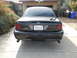 2007 Ford Crown Victoria - This black Ford Crown Victoria Police Interceptor is parked in front of a house with a basketball hoop visible.