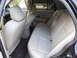 2007 Ford Crown Victoria - Rear interior of a 2007 Ford Crown Victoria, showing the bench seat and door panel.