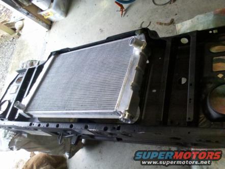 Radiator and front frame assembly with a new aluminum radiator installed