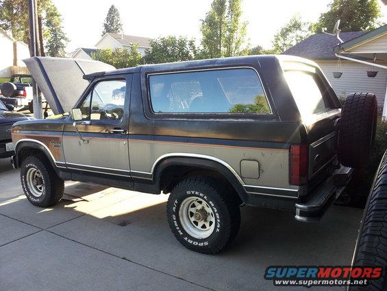 1986 Ford Bronco, two-tone brown/silver, hood open, spare tire on rear