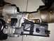 2009 Ford Crown Victoria - Close-up of a vehicle's steering column ignition switch assembly, revealing mechanical components and signs of age.