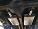 1964 Ford Ranchero - Underside view of a 1964 Ford Ranchero's dual exhaust system and rear axle assembly.