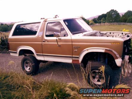 1982 Ford Bronco parked outdoors with hood open, showing the engine bay