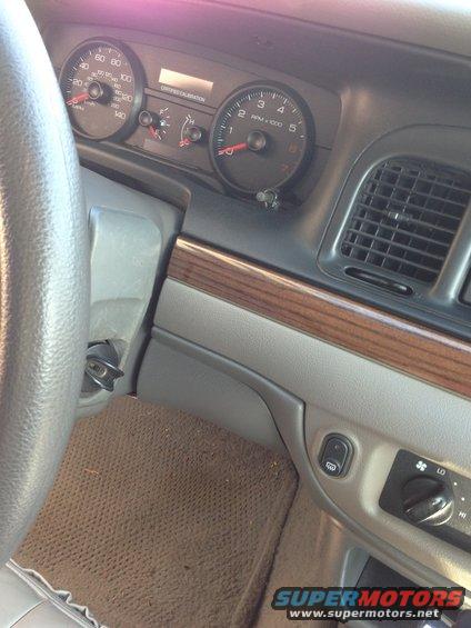 2007 Ford Crown Victoria interior dashboard with speedometer and tachometer visible