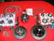 1978 Ford Bronco - A collection of differential gears, bearings, and gaskets is laid out on a red surface.