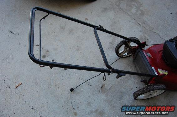 Red lawn mower handle and wheels