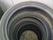 1993 Ford Probe - Several tires are stacked on top of each other, with text visible on the sidewall of the top tire.