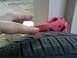 1993 Ford Probe - A penny is used to measure the tread depth of a tire, indicating it may need replacement.